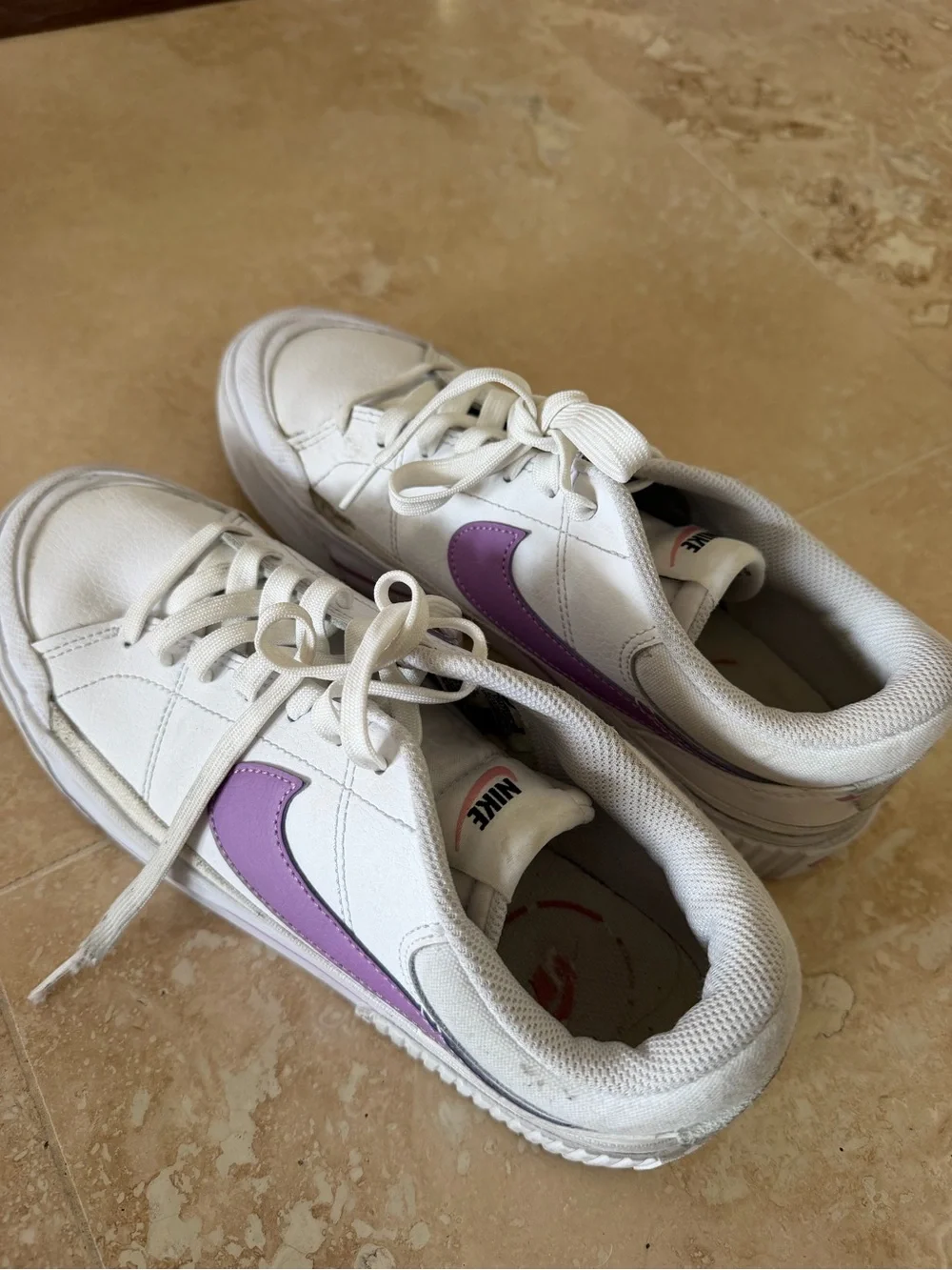 Nike Women’s White Low-Top Sneaker with Purple Swoosh Accent